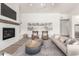 Inviting living room with a fireplace, comfortable seating, and ample natural light at 2505 E Lehi Rd # 16, Mesa, AZ 85213