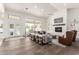 Spacious living room with a fireplace, comfortable seating, and views of the backyard pool at 2505 E Lehi Rd # 16, Mesa, AZ 85213
