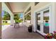 Covered patio featuring stamped concrete, French doors, and views of the backyard and pool at 2505 E Lehi Rd # 16, Mesa, AZ 85213