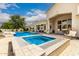 Backyard oasis showcasing a pool, spa, patio area, outdoor seating, and lush landscaping at 2505 E Lehi Rd # 16, Mesa, AZ 85213