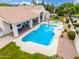 A well maintained pool and spa are surrounded by a clean patio and yard at 2505 E Lehi Rd # 16, Mesa, AZ 85213