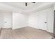 Bright, empty room with light wood floors and white trim at 2505 E Lehi Rd # 16, Mesa, AZ 85213