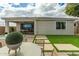 Backyard view showcasing patio, outdoor dining, and well-maintained lawn at 2637 N 195Th Dr, Buckeye, AZ 85396