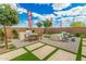 Inviting backyard with grill, dining area, and fire pit for outdoor enjoyment at 2637 N 195Th Dr, Buckeye, AZ 85396