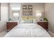Comfortable bedroom with a queen sized bed, designer accents, and dual nightstands at 2637 N 195Th Dr, Buckeye, AZ 85396