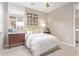 Comfortable bedroom with a queen sized bed, designer accents, and a window at 2637 N 195Th Dr, Buckeye, AZ 85396