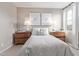 Comfortable bedroom with natural light, complemented by stylish lamps and wall decor at 2637 N 195Th Dr, Buckeye, AZ 85396