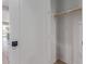 This is a closet with a wood hanging bar and a black door knob at 2637 N 195Th Dr, Buckeye, AZ 85396