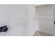 White closet with a wood hanging bar and a black door knob at 2637 N 195Th Dr, Buckeye, AZ 85396