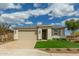 Attractive single-Gathering home boasting a well-kept lawn, stone detailing, and a two-car garage at 2637 N 195Th Dr, Buckeye, AZ 85396
