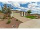 Beautiful home featuring a lush lawn, stone accents, and a spacious driveway at 2637 N 195Th Dr, Buckeye, AZ 85396