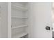 This is a pantry with a door and four shelves at 2637 N 195Th Dr, Buckeye, AZ 85396