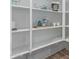 Walk-in pantry with organized shelving for ample storage, featuring white wire baskets and a cookbook display at 2637 N 195Th Dr, Buckeye, AZ 85396