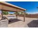 A covered patio and a backyard inground pool at 2794 E Cowboy Cove Trl, San Tan Valley, AZ 85143