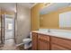 Bathroom with a wood vanity and a view into the bedroom at 2794 E Cowboy Cove Trl, San Tan Valley, AZ 85143