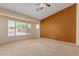 Spacious bedroom with a ceiling fan and large windows overlooking the backyard pool at 2794 E Cowboy Cove Trl, San Tan Valley, AZ 85143