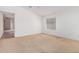 Spacious bedroom with a large window, neutral carpet, and plenty of natural light at 2794 E Cowboy Cove Trl, San Tan Valley, AZ 85143