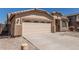 Charming single-story home featuring a spacious two-car garage and desert landscaping at 2794 E Cowboy Cove Trl, San Tan Valley, AZ 85143
