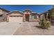 Charming single-story home with a well-maintained front yard and desert landscaping at 2794 E Cowboy Cove Trl, San Tan Valley, AZ 85143