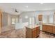 Bright kitchen features a center island, wood cabinetry, and easy access to living space at 2794 E Cowboy Cove Trl, San Tan Valley, AZ 85143