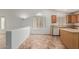 Cozy kitchen with tile floors, wood cabinets, white appliances, and bright lighting at 2794 E Cowboy Cove Trl, San Tan Valley, AZ 85143