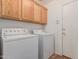 Laundry room with washer, dryer and storage above at 2794 E Cowboy Cove Trl, San Tan Valley, AZ 85143