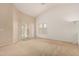 Open living room with sliding door to backyard, carpet flooring and lots of natural light at 2794 E Cowboy Cove Trl, San Tan Valley, AZ 85143