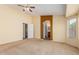 Spacious main bedroom boasts a ceiling fan and entry to the main bathroom at 2794 E Cowboy Cove Trl, San Tan Valley, AZ 85143
