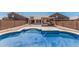 Backyard pool surrounded by patio, ideal for relaxing and enjoying the outdoors at 2794 E Cowboy Cove Trl, San Tan Valley, AZ 85143