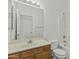 Clean bathroom with a traditional vanity, large mirror, standard toilet, and shower-tub combination at 2932 N 115Th Ln, Avondale, AZ 85392