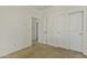 Well-lit room boasts a closet and an attached door with a view into another room at 2932 N 115Th Ln, Avondale, AZ 85392