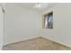 Bedroom featuring neutral carpet, ceiling fan, a window offering natural light, and closet space at 2932 N 115Th Ln, Avondale, AZ 85392