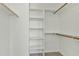 Walk-in closet with carpeted floor, offering plenty of shelf and hanging storage space at 2932 N 115Th Ln, Avondale, AZ 85392