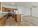 This kitchen includes stainless appliances, tile counters, and eat-in island, perfect for cooking at 2932 N 115Th Ln, Avondale, AZ 85392
