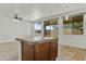 Eat-in kitchen features tile countertop island, and stainless steel appliances with backyard views at 2932 N 115Th Ln, Avondale, AZ 85392