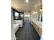 Modern bathroom featuring a soaking tub, glass shower, double vanity, and walk-in closet at 31505 N 166Th Pl, Scottsdale, AZ 85262