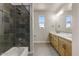 Bright bathroom featuring a tub shower, double sink vanity, and a large mirror, offering both style and functionality at 31505 N 166Th Pl, Scottsdale, AZ 85262