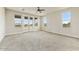 Bright, spacious bedroom with neutral carpet, offering a serene retreat with picturesque views from several windows at 31505 N 166Th Pl, Scottsdale, AZ 85262