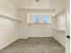 Spacious walk-in closet with neutral carpet, and shelving providing ample storage and organization options at 31505 N 166Th Pl, Scottsdale, AZ 85262