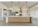 Open-concept kitchen with granite counters, stainless appliances, and modern pendant lighting at 31505 N 166Th Pl, Scottsdale, AZ 85262