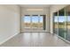 Bright, open living room with tile flooring, large windows and a sliding glass door showcasing mountain views at 31505 N 166Th Pl, Scottsdale, AZ 85262