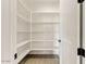Well-organized pantry with ample shelving, offering plentiful storage and easy access to kitchen essentials at 31505 N 166Th Pl, Scottsdale, AZ 85262