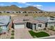 Aerial shot of a modern home in a community with beautiful mountain views at 32268 N 133Rd Ln, Peoria, AZ 85383