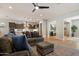 Inviting living room featuring an open floorplan, ceiling fan and hardwood floors at 32268 N 133Rd Ln, Peoria, AZ 85383