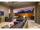 Cozy outdoor patio with comfortable seating, fire pit and views of the desert landscape at 32268 N 133Rd Ln, Peoria, AZ 85383