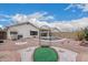 Backyard oasis featuring a pool, desert landscaping, and privacy fencing at 3349 E Lavey Ln, Phoenix, AZ 85032