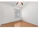 A bright bedroom with laminate floors and a window at 3349 E Lavey Ln, Phoenix, AZ 85032
