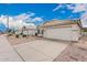Street view of a single-Gathering home featuring a tile roof, desert landscaping, and a two-car garage at 3349 E Lavey Ln, Phoenix, AZ 85032