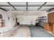 Spacious garage with ample storage and a workbench area at 3349 E Lavey Ln, Phoenix, AZ 85032