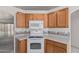 A functional kitchen featuring white appliances and light countertops at 3349 E Lavey Ln, Phoenix, AZ 85032